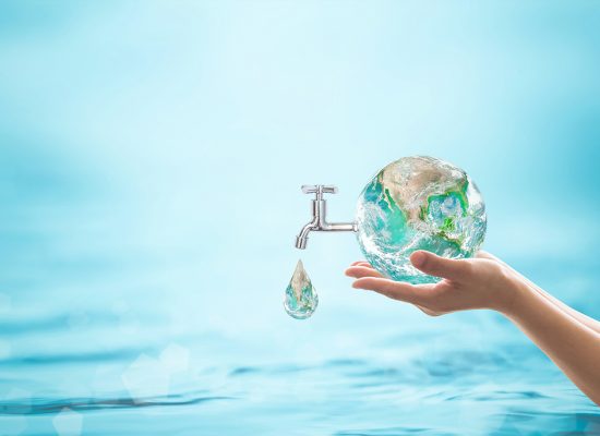 World water day, saving water quality, sanitation and environmental protection concept. World water day, saving bio natural environment concept with hands holding green planet globe with drop water and blue ocean background. Element of the image furnished by NASA